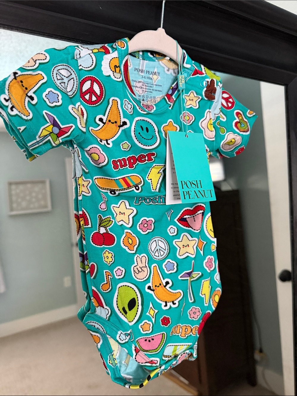 Posh Peanut Teal Graphic Onesie with Colorful Icons